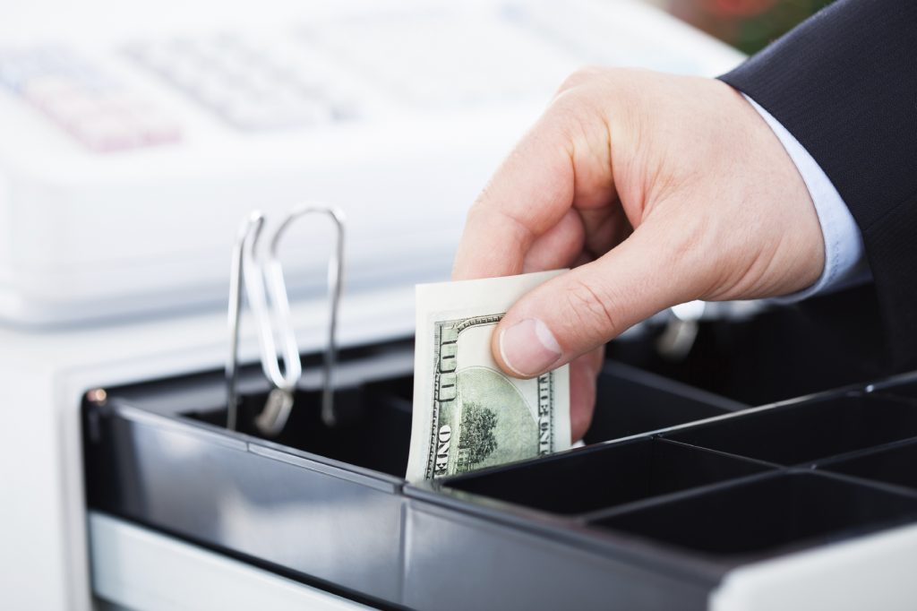 Hand With Dollar Notes - HospitalityLawyer.com®