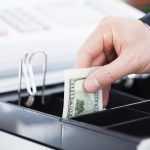Hand With Dollar Notes - HospitalityLawyer.com®