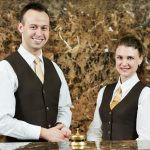 Hotel worker on reception - HospitalityLawyer.com®