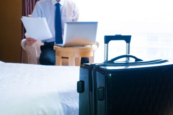 Businessman using laptop at hotel room