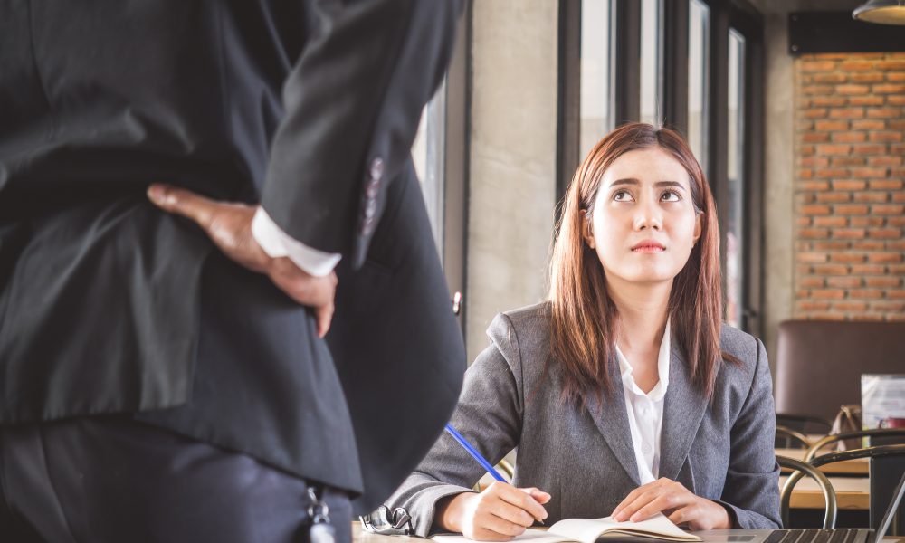Aggressive/angry boss complaining asian business woman(casual uniform) in cafe office