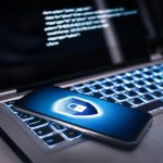 Phone lock to protect from cyber scam online data fraud or identity theft Laptop with hacker virus code in screen Phishing cybersecurity danger or ransomware attack - HospitalityLawyer.com® Protecting Your Digital Privacy: Practices, Tools, and Using Professional Security