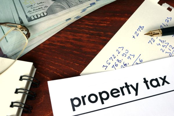 Property tax written on a paper. Financial concept.
