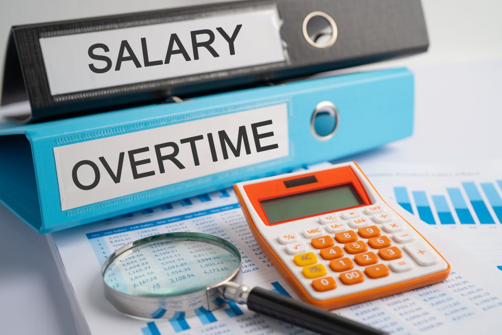 Salary Overtime Binder data finance report business with graph analysis in office - HospitalityLawyer.com® Labor Department’s Proposed Overtime Rule Could Raise Salary Floor to $55k: Here Are 8 Ways Employers Can Prepare Now