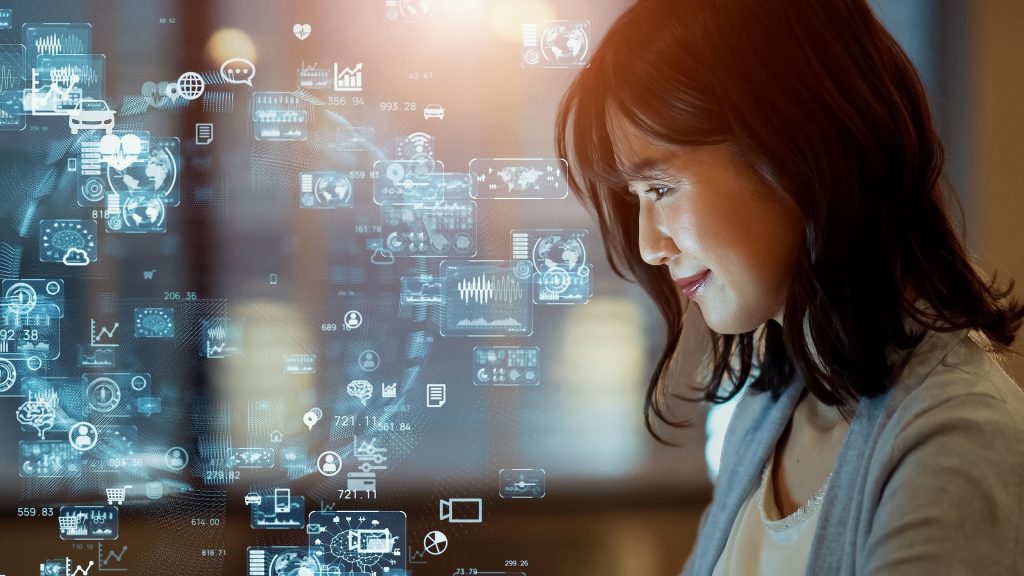 Asian-woman-watching-hologram-screens - HospitalityLawyer.com®