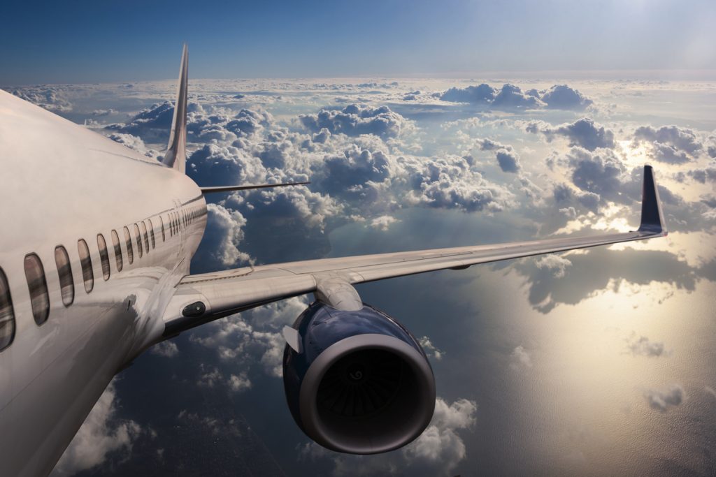 Body of an Airplane Flying Through Dark Clouds - HospitalityLawyer.com® Body of an Airplane Flying Through Dark Clouds