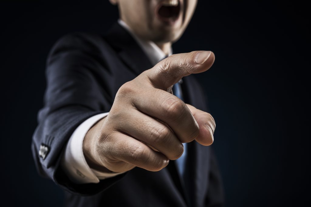 Businessman sticks out a finger and reproves it - HospitalityLawyer.com® Businessman sticks out a finger and reproves it.