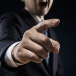 Businessman sticks out a finger and reproves it - HospitalityLawyer.com® Businessman sticks out a finger and reproves it.