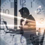 Businessman working hard in his office - HospitalityLawyer.com® Work deadline, business success, and strategy concept. Double exposure