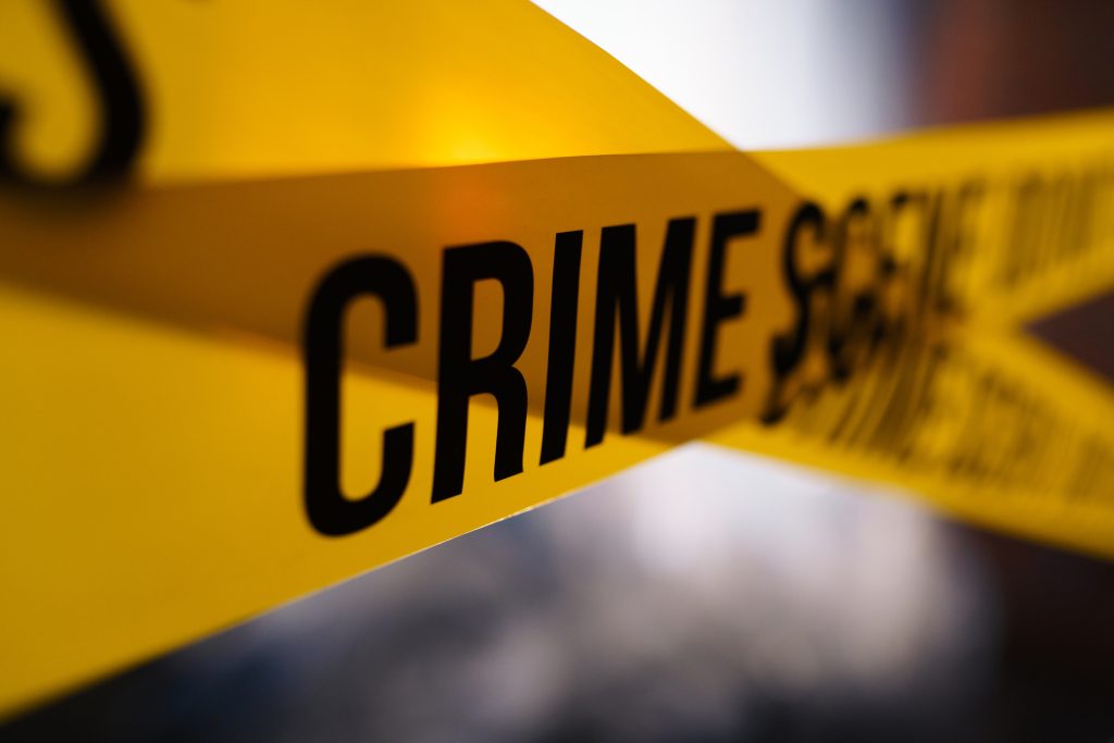 Barricade tape in close up on a blurred background - HospitalityLawyer.com® Barricade tape in close up on a blurred background