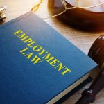 Employment law concept Book and gavel on a desk - HospitalityLawyer.com® Employment law concept. Book and gavel on a desk.