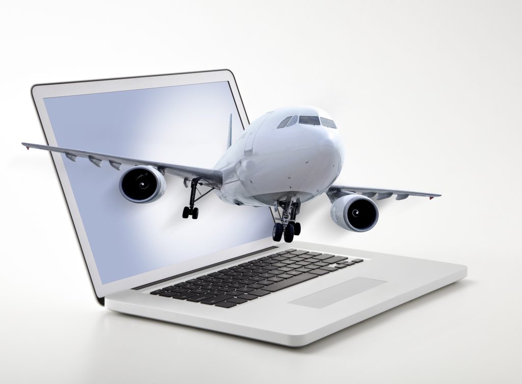 Flight booking online - HospitalityLawyer.com® Passenger plane coming out of laptop screen symbolizing online ticketing