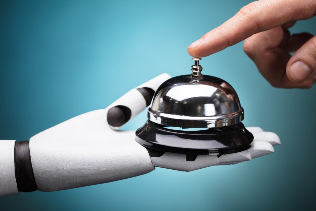 Person Ringing Service Bell Hold By Robot - HospitalityLawyer.com® Person's Ringing Service Bell Hold By Robot On Turquoise Background