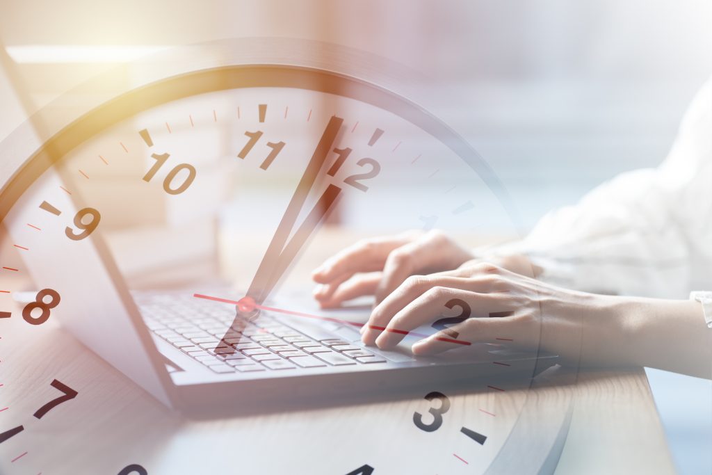 Business working times concept people work typing on laptop computer overlay with in time clock to lunch break - HospitalityLawyer.com®