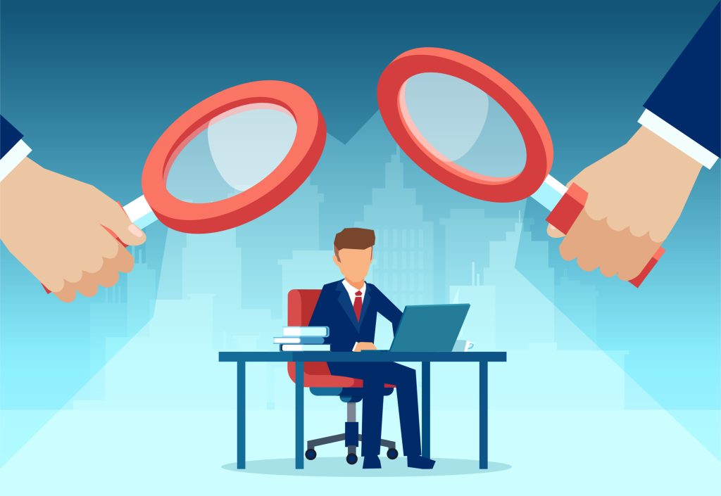 Vector of two managers with magnifying glass watching over at employee working at his desk on computer - HospitalityLawyer.com®