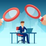 Vector of two managers with magnifying glass watching over at employee working at his desk on computer - HospitalityLawyer.com®