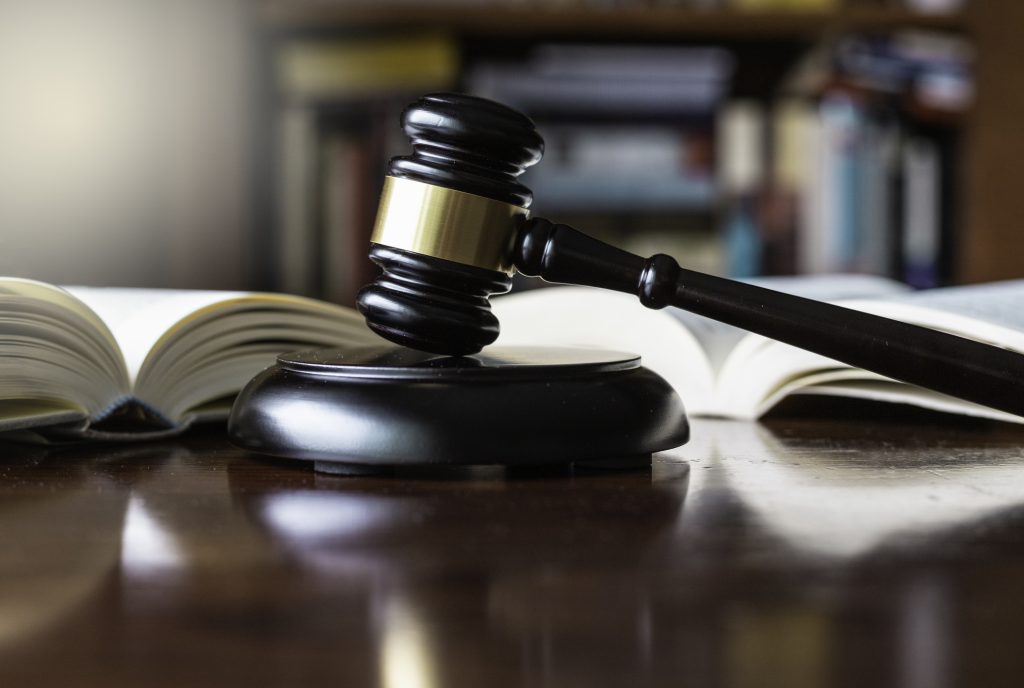 Judges gavel and wooden block used in trials and auctions - HospitalityLawyer.com®