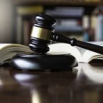 Judges gavel and wooden block used in trials and auctions - HospitalityLawyer.com®