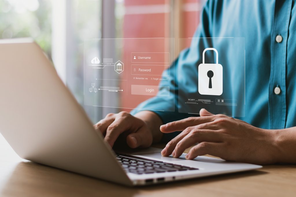 Cybersecurity and privacy concepts to protect data Lock icon and internet network security technology Businessmen protecting personal data on laptop and virtual interfaces - HospitalityLawyer.com®