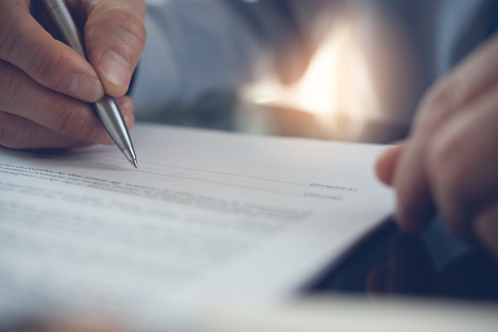 Signing contract - HospitalityLawyer.com®