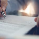 Signing contract - HospitalityLawyer.com®