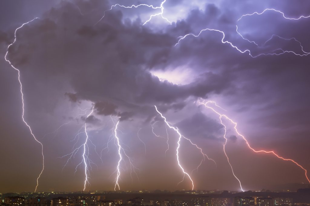 Curtain of lightning over city - HospitalityLawyer.com®