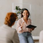 Group Business Meeting at Bright Beige Office - HospitalityLawyer.com®