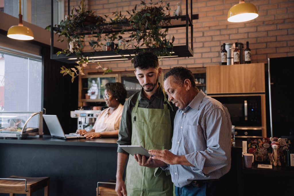 Coffee shop owner talking to employee - HospitalityLawyer.com®