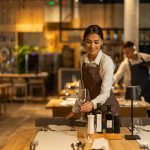 Beautiful waitress working - HospitalityLawyer.com®