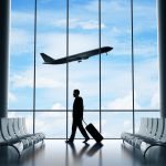 businessman in airport - HospitalityLawyer.com®