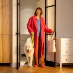 Woman comes home with her dog from a walk - HospitalityLawyer.com®